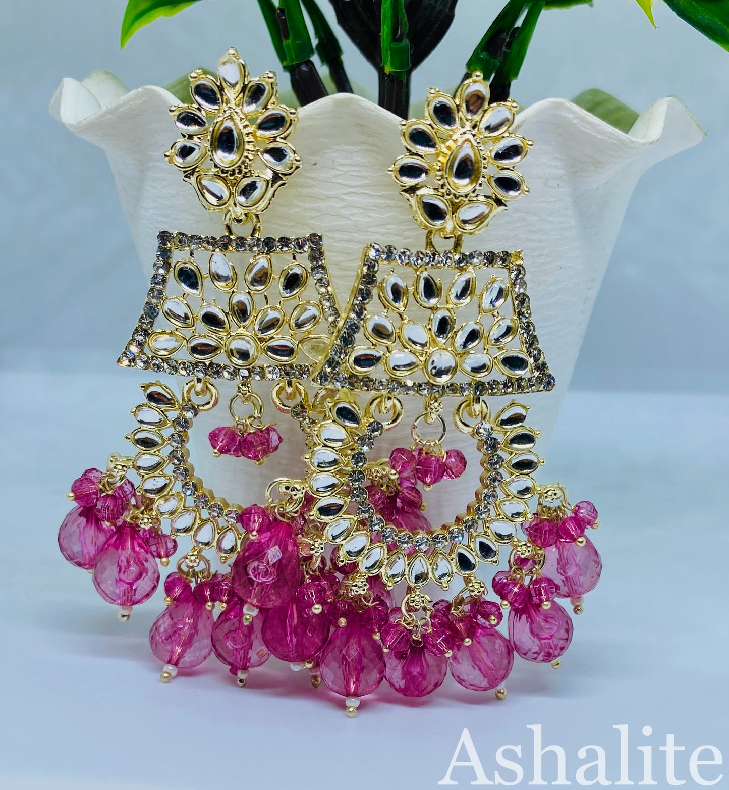 कृष्ण संयुता Gold-Plated Chandbali Earrings with Fuchsia Pink Beads and Floral Design