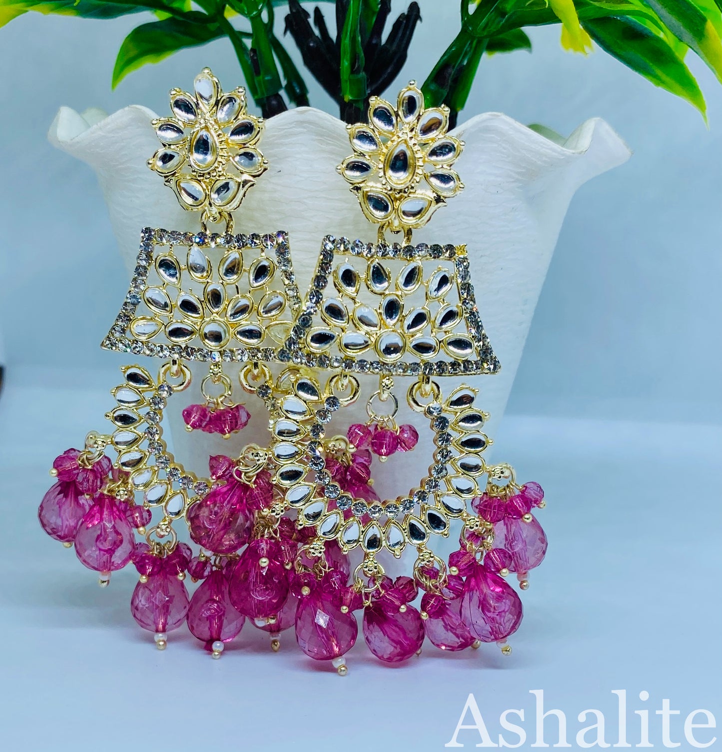 कृष्ण संयुता Gold-Plated Chandbali Earrings with Fuchsia Pink Beads and Floral Design