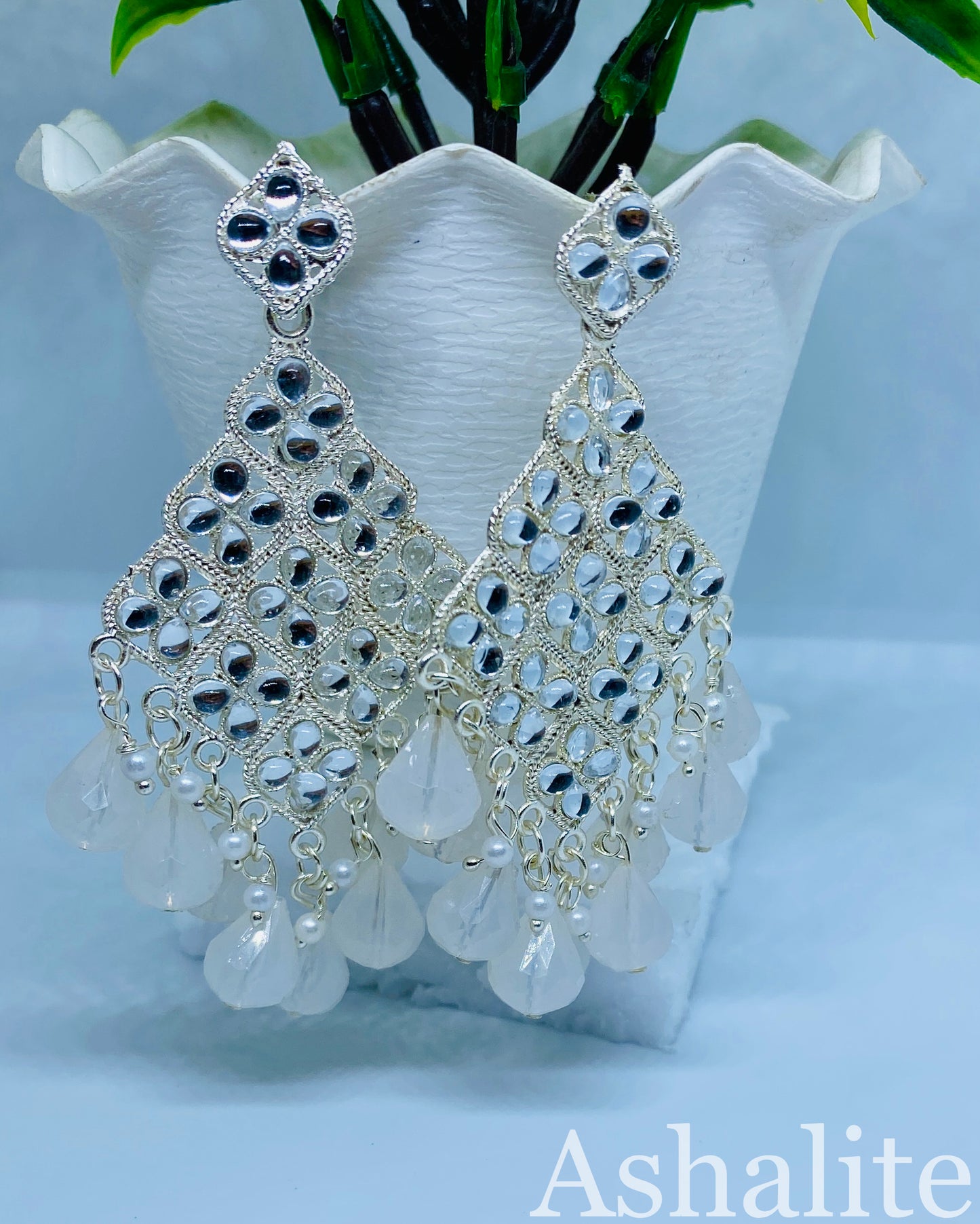 दामोदर प्रिया Iridescent Milky White Chandbali Earrings with Floral Accents