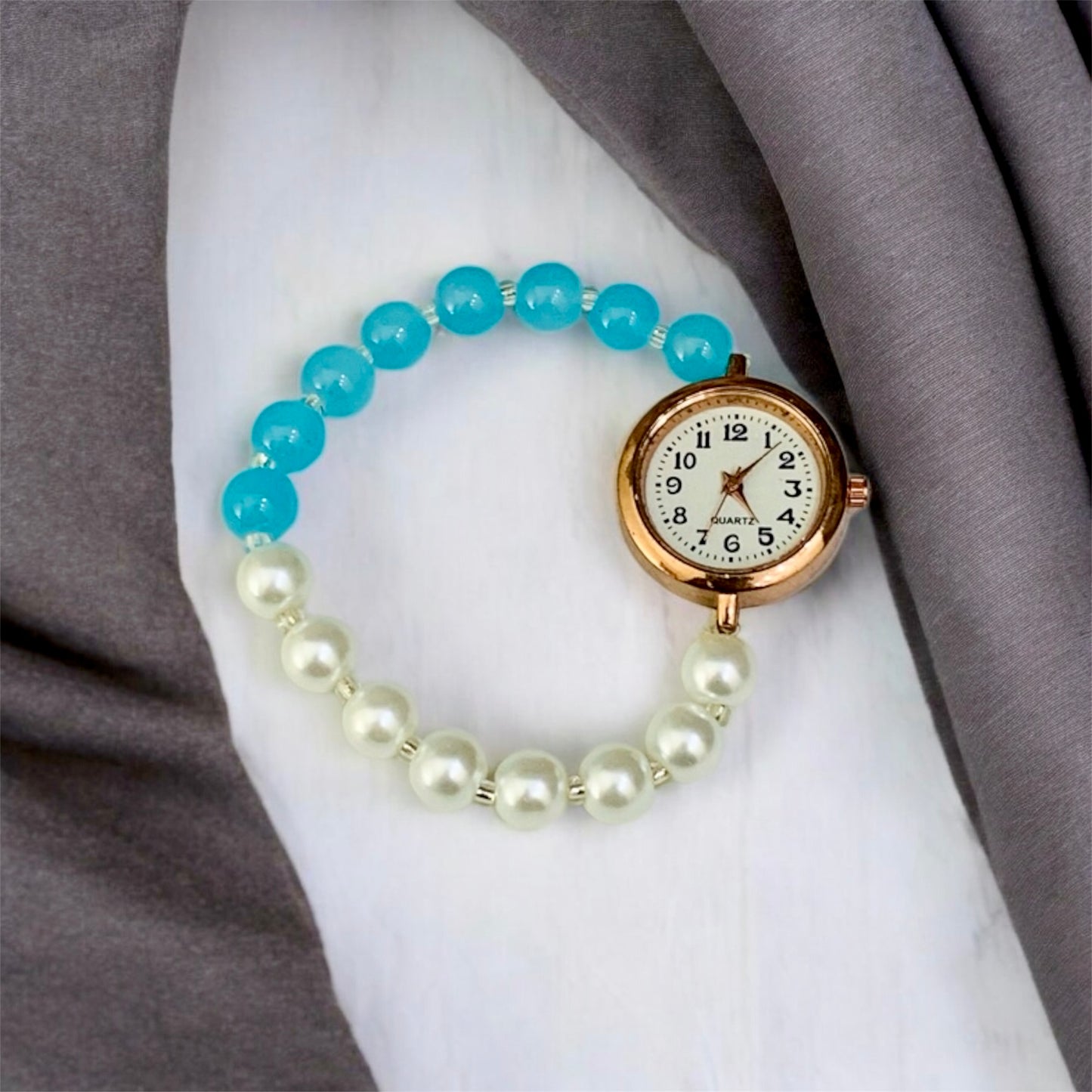 अंबिका Sky Blue & Silver Pearls Bead Bracelet with Rose Gold Dial Watch