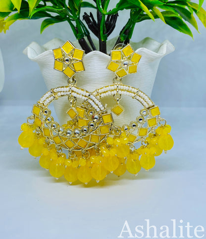 Close-up of Keshvi yellow Kundan pearl chandbali stonework — buy earrings India
