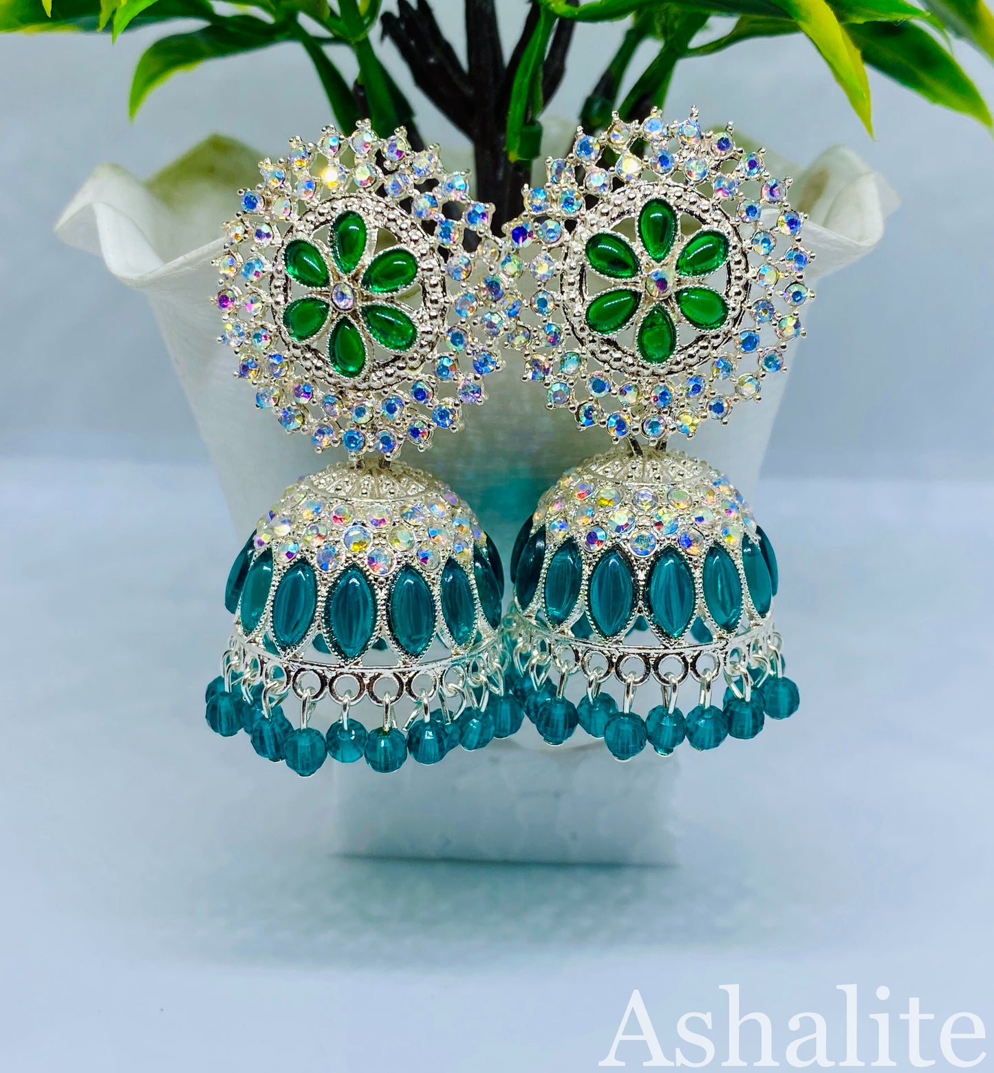 नित्या Stunning Green and Silver-Plated Jhumka Earrings