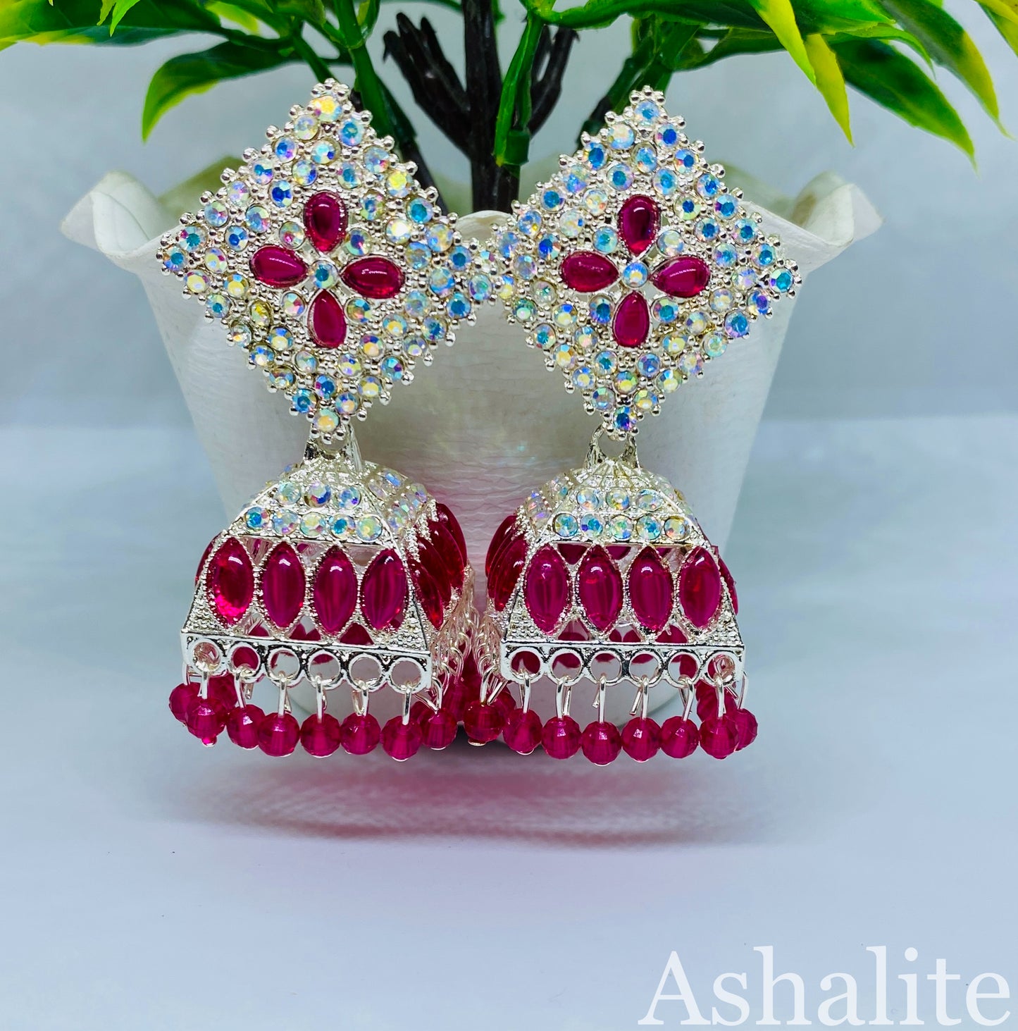 हेमा-सुंदरी Pink and Silver-Plated Jhumka Earrings