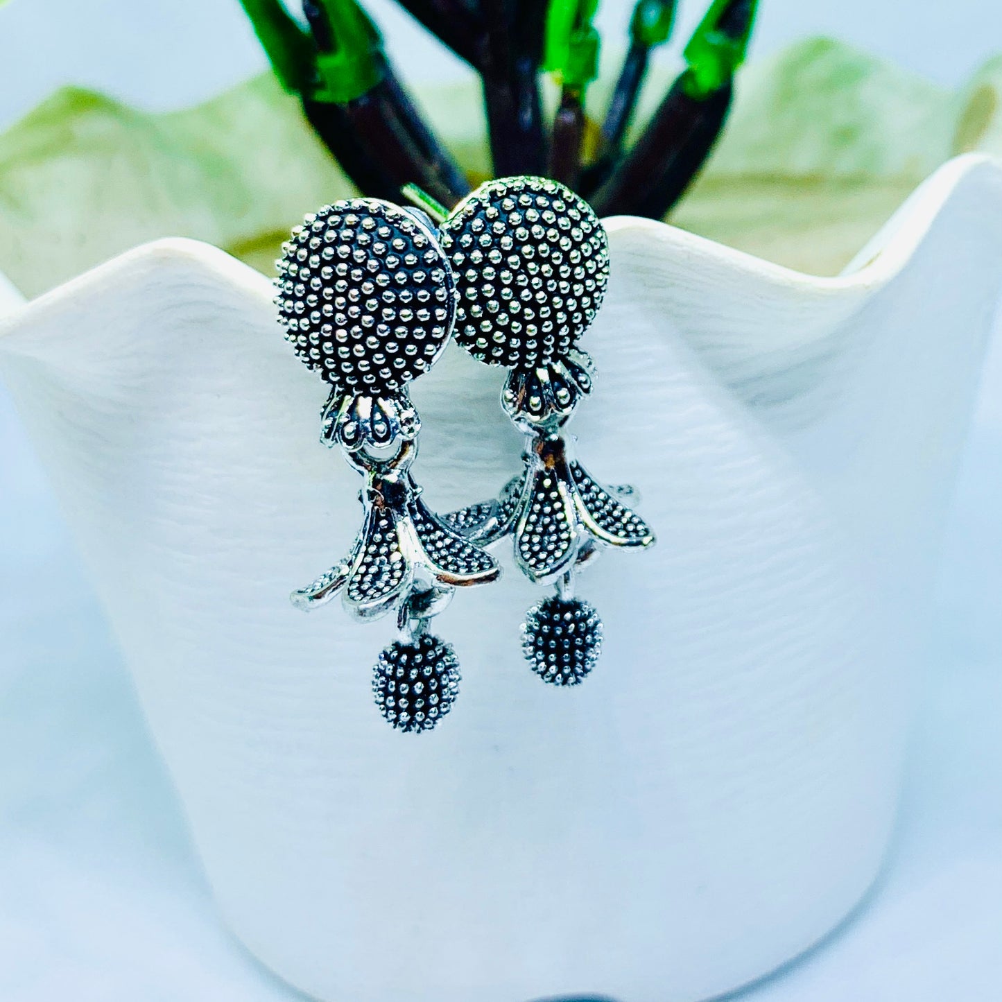 “Antique Silver Plated Floral Drop Earrings with Textured Detailing”