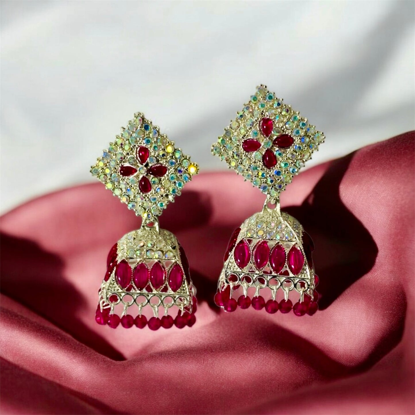 हेमा-सुंदरी Pink and Silver-Plated Jhumka Earrings